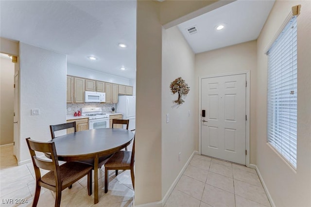 dining area featuring light tile patterned floors