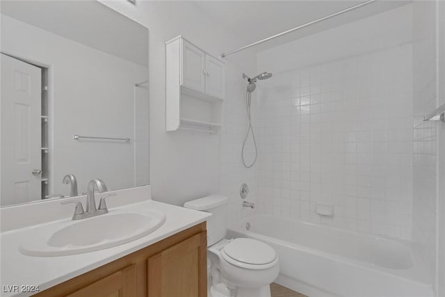 full bathroom featuring vanity, toilet, and tiled shower / bath combo