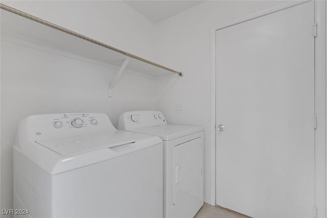 clothes washing area with independent washer and dryer