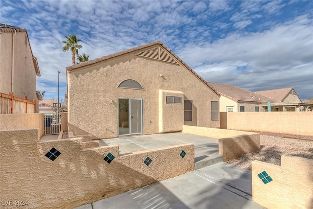 rear view of house featuring a patio