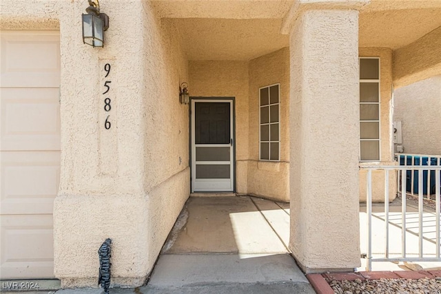 entrance to property featuring a garage