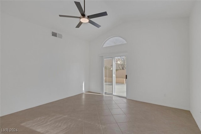 spare room with high vaulted ceiling, ceiling fan, and light tile patterned flooring