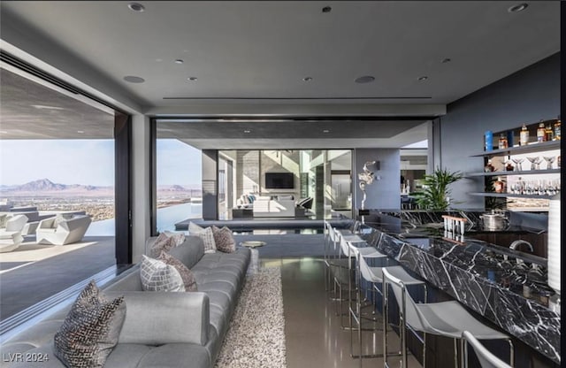 interior space featuring a mountain view and concrete flooring