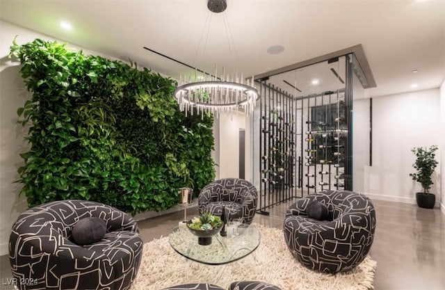 wine area with a chandelier and concrete floors