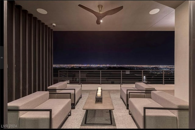 patio at twilight featuring outdoor lounge area and ceiling fan