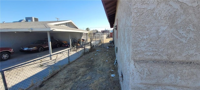 view of side of property featuring a carport