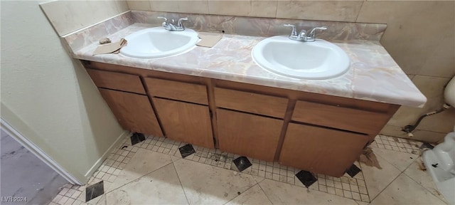 bathroom with tile patterned flooring and vanity