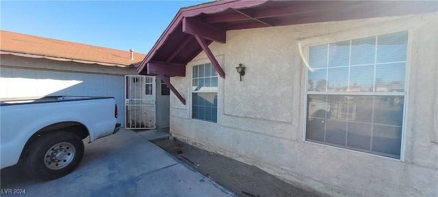 view of property exterior with a garage