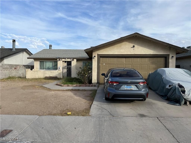 single story home featuring a garage