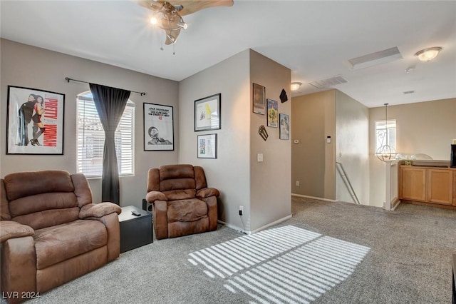 living room with light carpet and ceiling fan