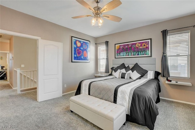 carpeted bedroom with ceiling fan