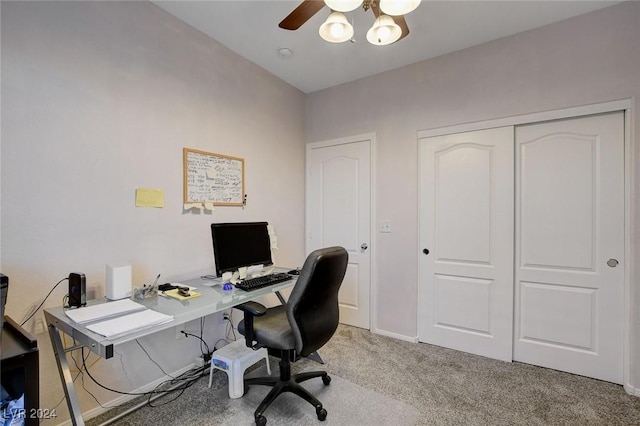 office space with light carpet and ceiling fan