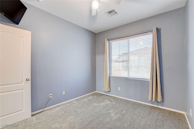 unfurnished room with ceiling fan and carpet floors