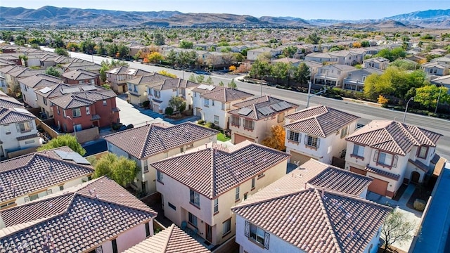 birds eye view of property featuring a mountain view