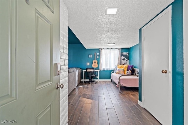 interior space featuring hardwood / wood-style floors and a textured ceiling