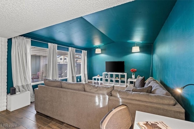 living room with hardwood / wood-style flooring and lofted ceiling