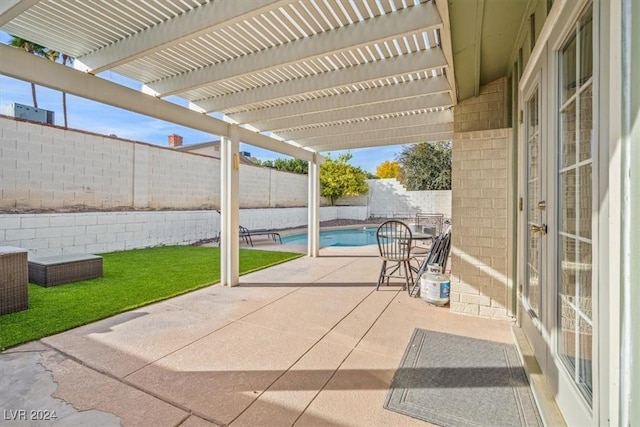 view of patio featuring a pergola and a fenced in pool