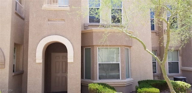 property entrance featuring central AC unit