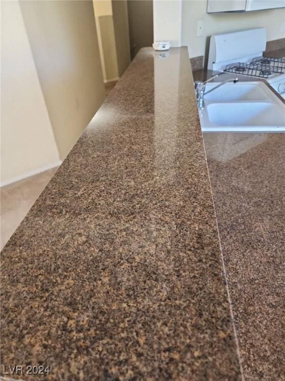 interior details with white range oven and sink