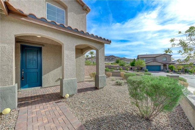 doorway to property with a mountain view