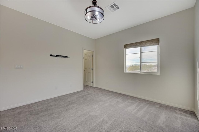 spare room with light colored carpet