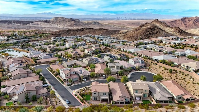 birds eye view of property featuring a mountain view