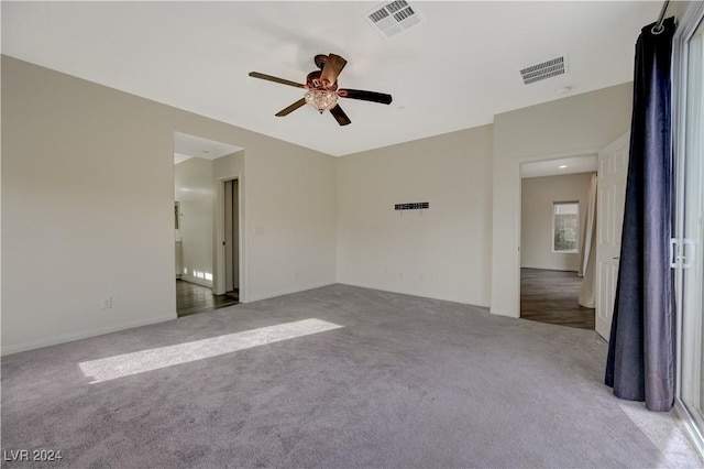 carpeted empty room with ceiling fan