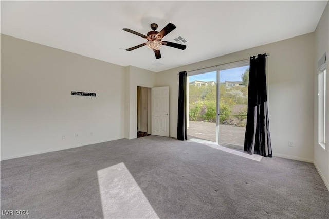 unfurnished room featuring ceiling fan and light colored carpet