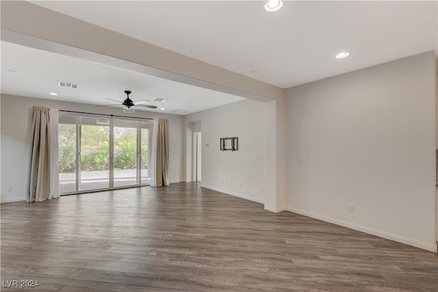 empty room featuring hardwood / wood-style floors and ceiling fan