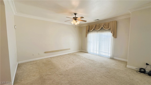 empty room with ceiling fan, ornamental molding, and light carpet