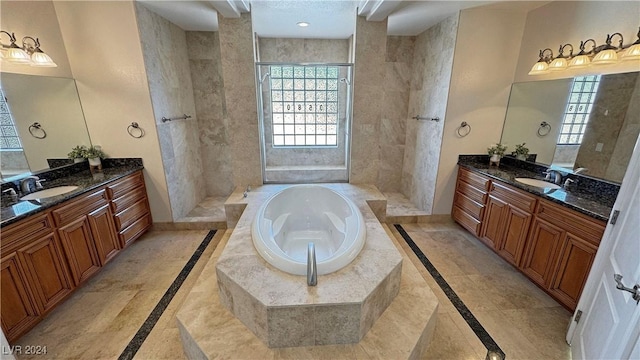 bathroom featuring tile patterned flooring, vanity, and separate shower and tub