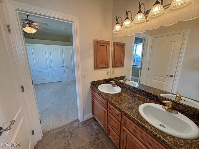 bathroom featuring tile patterned flooring, vanity, and ceiling fan