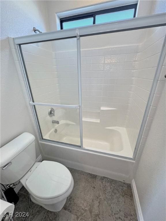 bathroom featuring toilet and enclosed tub / shower combo