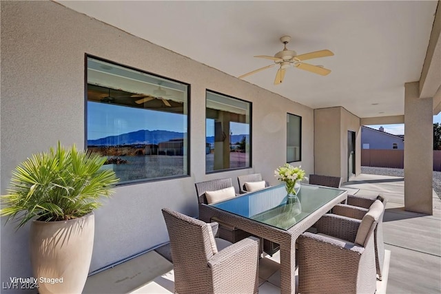 view of patio featuring ceiling fan