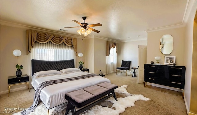 carpeted bedroom with multiple windows, ceiling fan, a textured ceiling, and ornamental molding