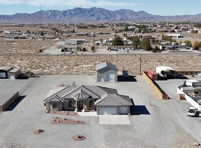 birds eye view of property with a mountain view