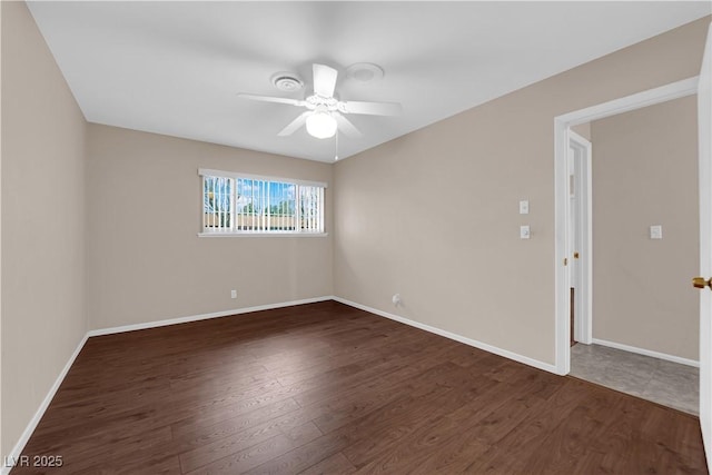 unfurnished room with wood finished floors, baseboards, and ceiling fan