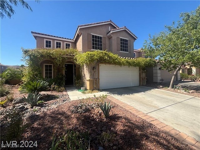 view of front of property with a garage