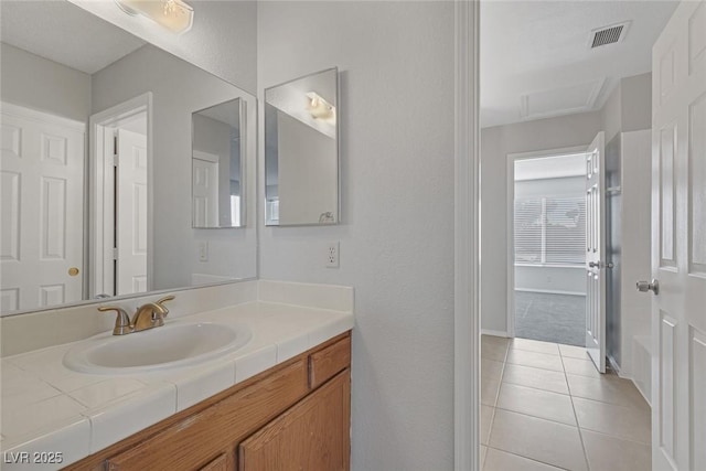 bathroom with vanity and tile patterned flooring