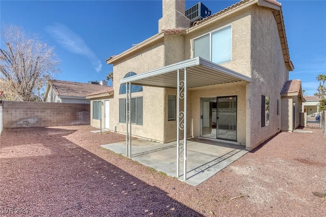 back of house with a patio area and central air condition unit