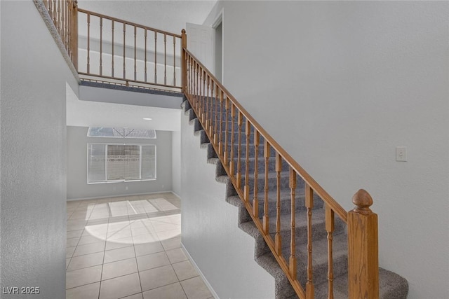 stairway with tile patterned flooring