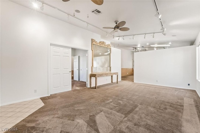 interior space with ceiling fan and rail lighting