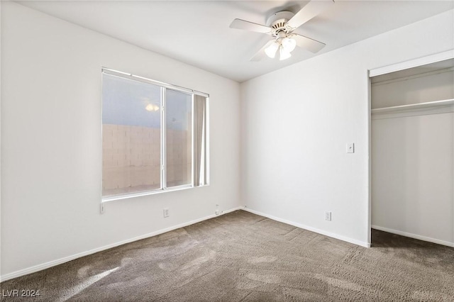 unfurnished bedroom featuring ceiling fan, a closet, and carpet floors