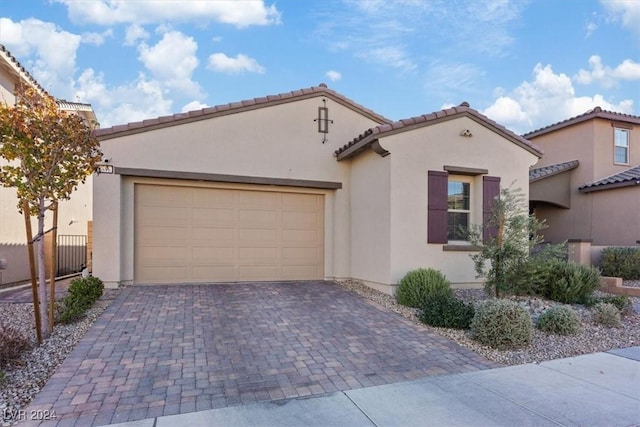 mediterranean / spanish-style house featuring a garage