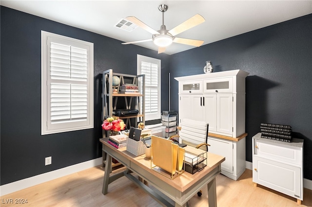 office area with ceiling fan and light hardwood / wood-style floors