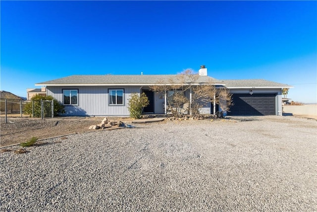 ranch-style house featuring a garage