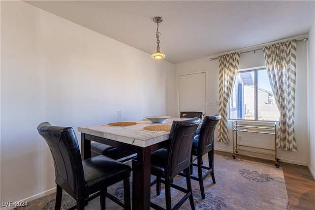 dining area featuring dark hardwood / wood-style floors