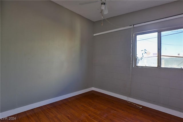 empty room featuring hardwood / wood-style floors and ceiling fan