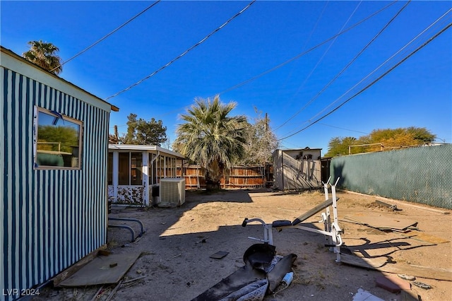 view of yard featuring central air condition unit