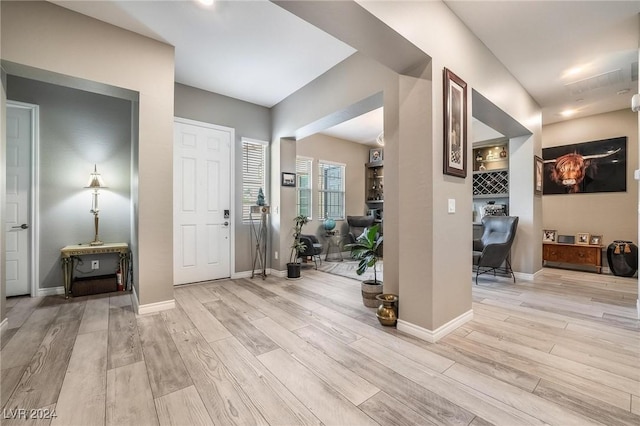 entryway with light hardwood / wood-style floors